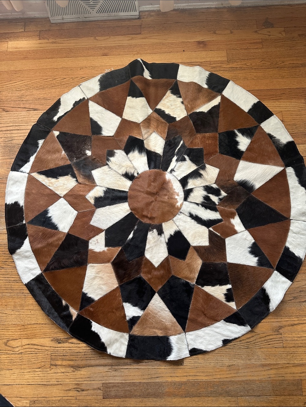 Hand Crafted Brown Black White Geometric Round Cowhide Rug